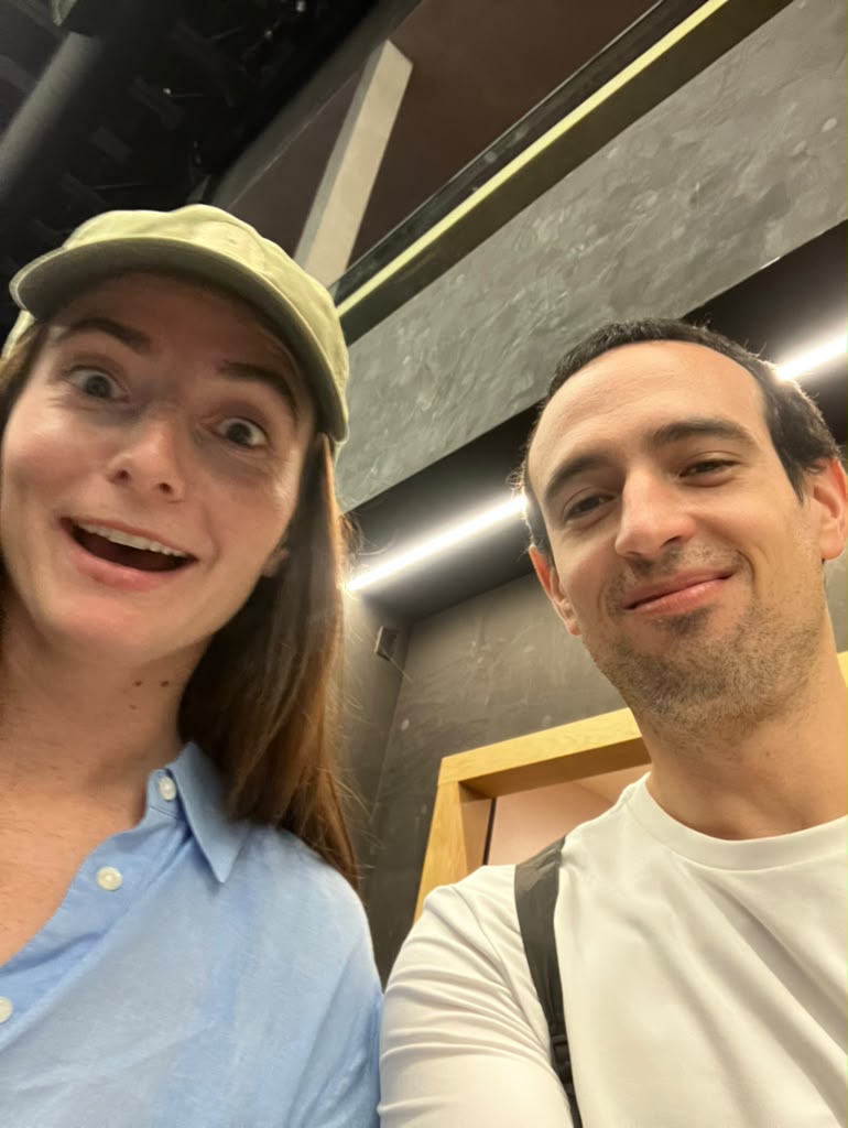 Selfie of Paulo with a friend in a green cap